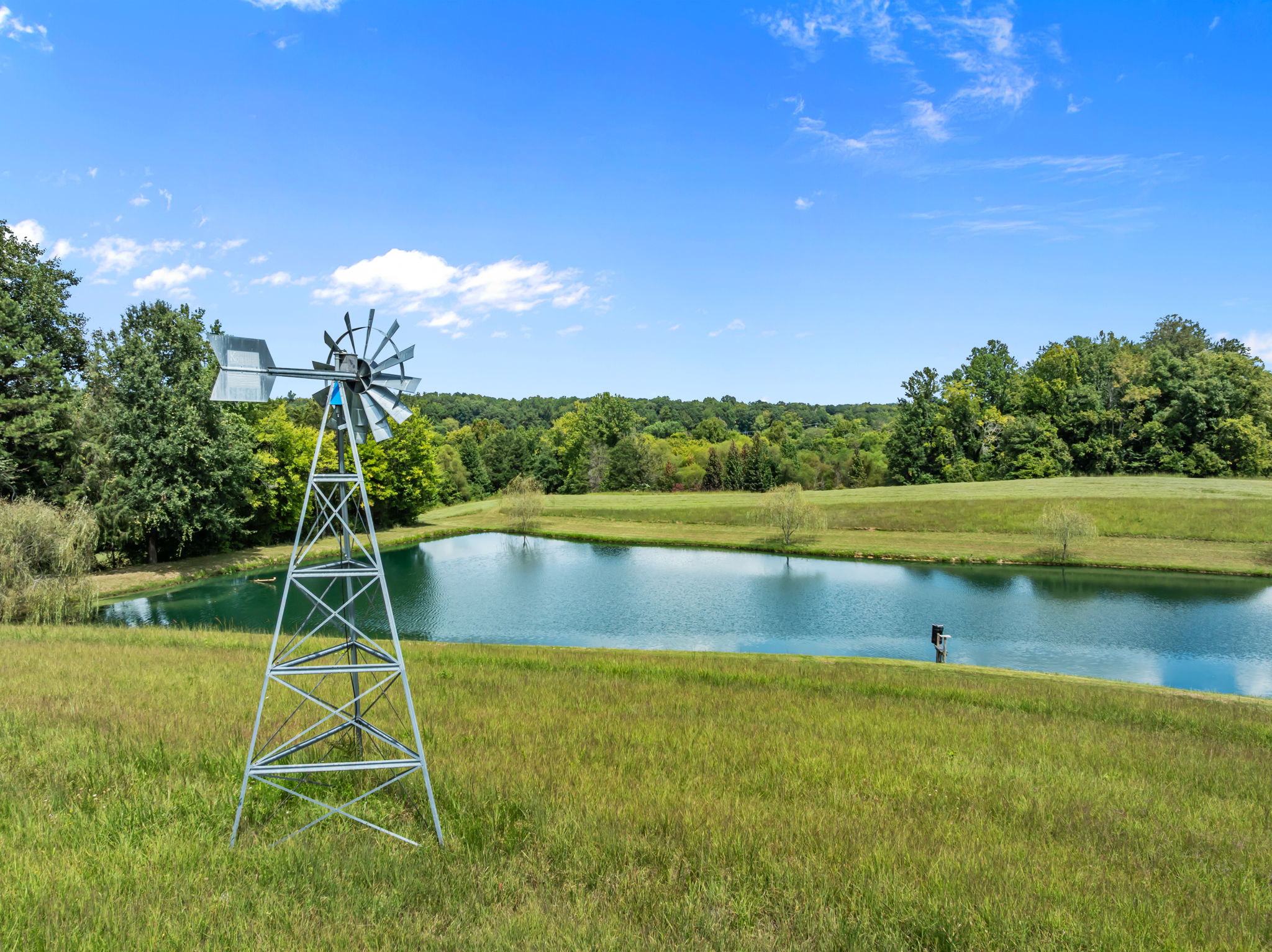 Pond with Windmill Aeration and Fish Feeder
