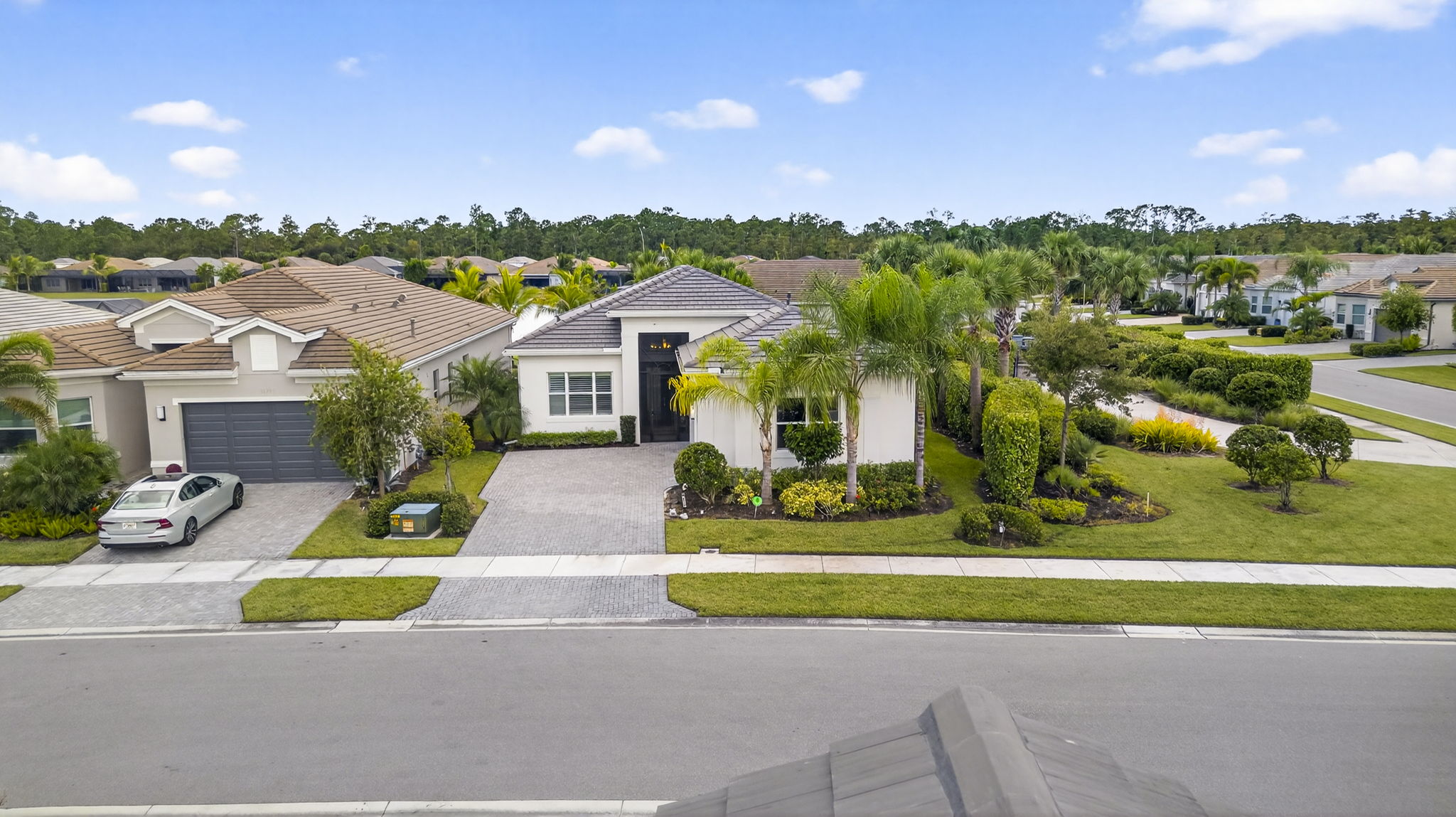 WELCOME HOME to your fabulous Riviera with screened front porch (great for cross breezes in colder months!)