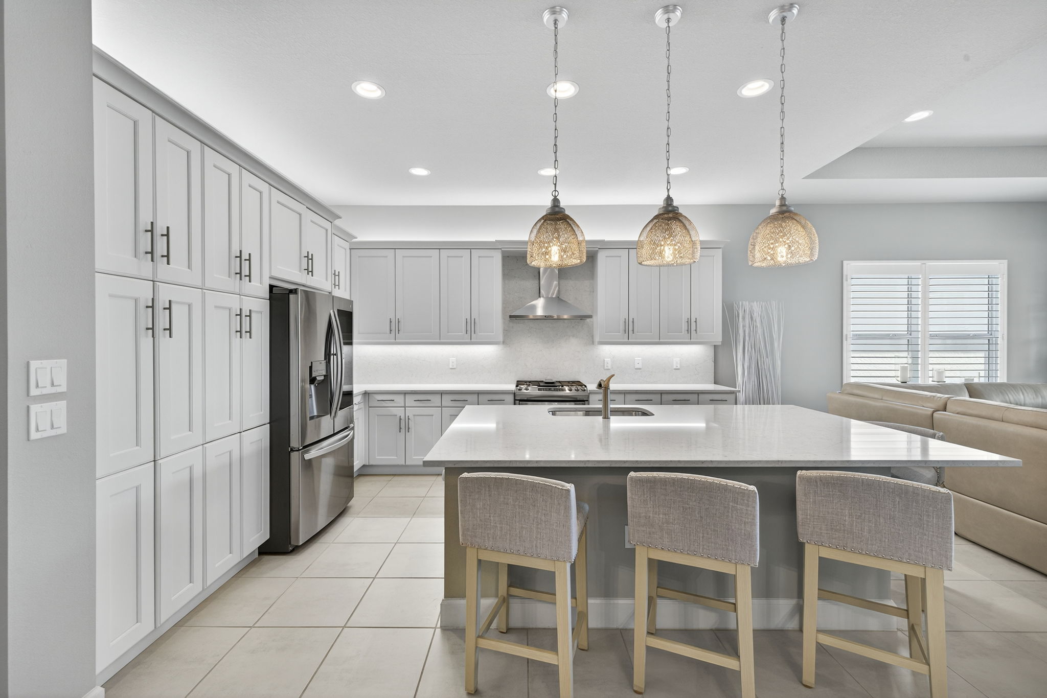 Island seats 5 (1 around the corner towards great room)