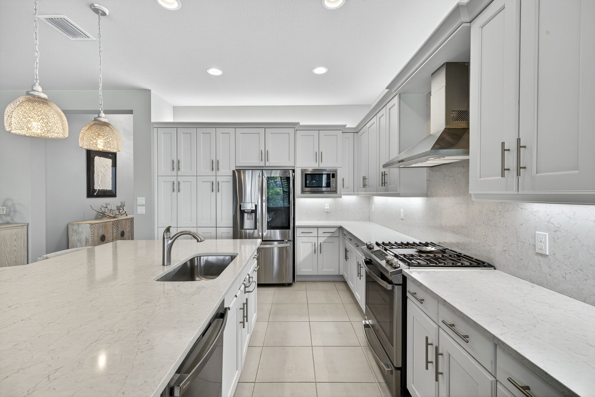 Elegance and gas cooking!!! Soft close drawers, microwave is air fryer and convection oven, too! Upgraded cabinets a huge plus!