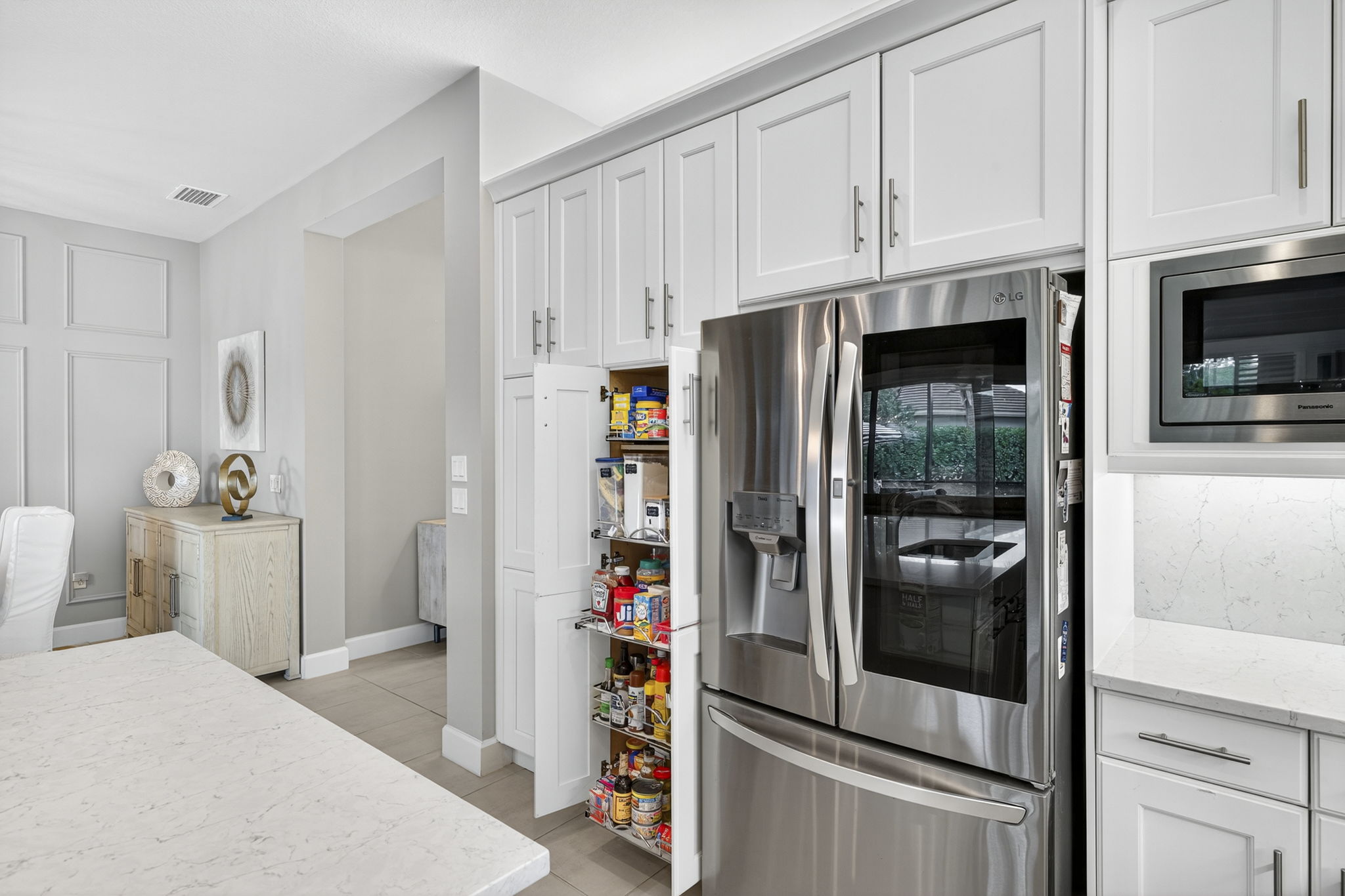 Upgraded appliances plus pull-outs in pantry and every lower level cabinet!