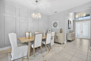 BEAUTIFUL decorative picture frame accent wall in dining area...