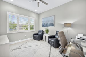 Located on the front of the house and to the left of the foyer, this den is super bright!