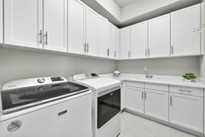 UPGRADED washer and dryer...plus a large utility tub and cabinets galore!!!