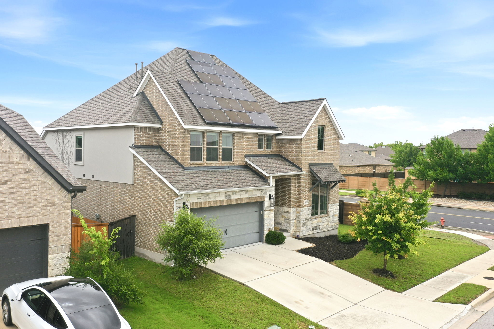 Aerial of Front of Home and Solar Panels