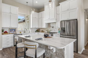 A large kitchen island for prepping or visiting.