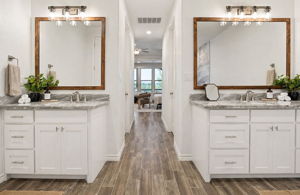 Dual vanities in the primary bathroom.
