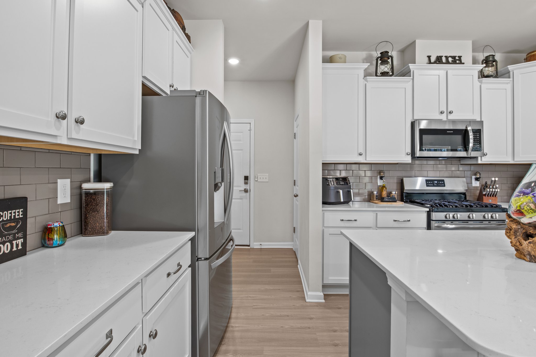 Garage door and additional storage space adjacent to the kitchen