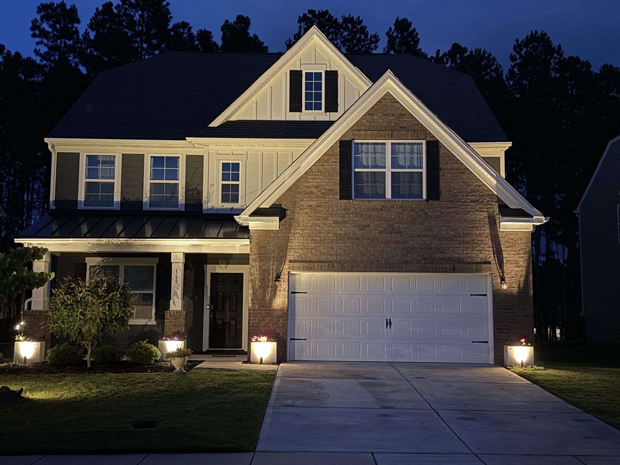 Home at night to showcase the landscape lighting