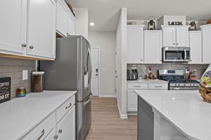 Garage door and additional storage space adjacent to the kitchen