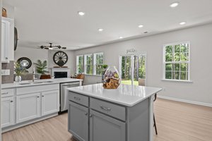 So many windows and natural light adorn this kitchen area