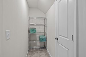 Large conditioned storage space adjacent to the third floor living area with walk-in access to the attic area