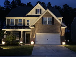 Home at night to showcase the landscape lighting