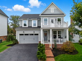 Covered front porch & upper level balcony