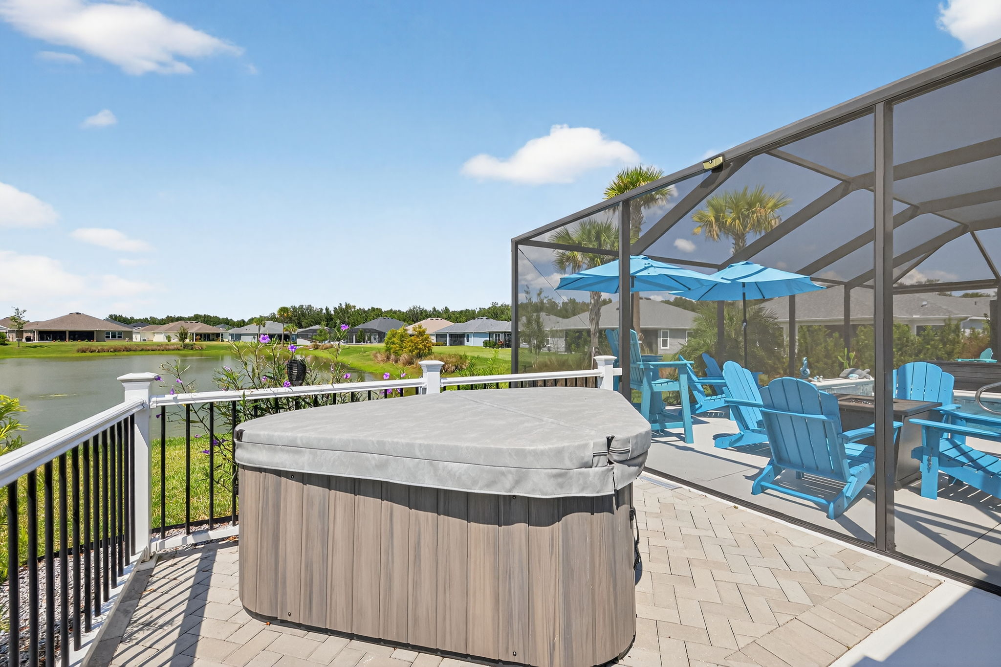 Rear Paver Deck with Hot Tub and Water Views
