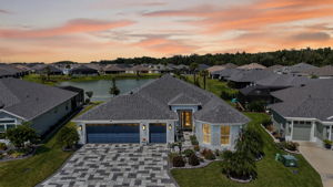 Twilight Aerial Front Elevation with Water Views