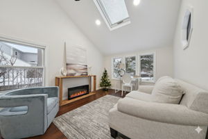Skylight and fireplace adorn family room