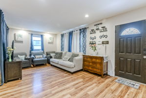 Cozy Living Room with Front Door View