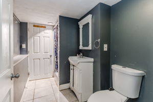 Bathroom with Tiled Flooring and Shower