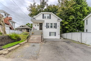 Wider Front View Showing Driveway and Entrance