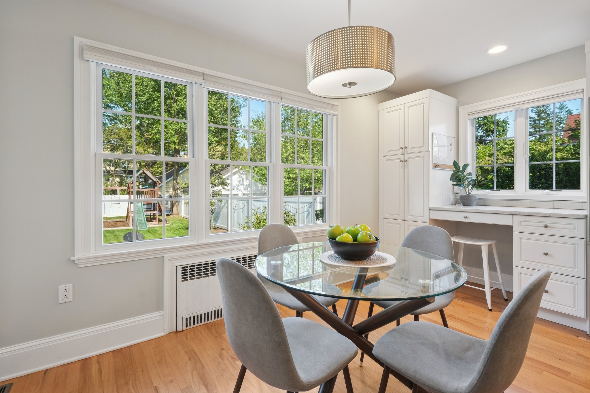 Cooking, sipping, gathering — all while keeping an eye on the backyard through those big, beautiful windows. This kitchen makes multitasking look effortless.