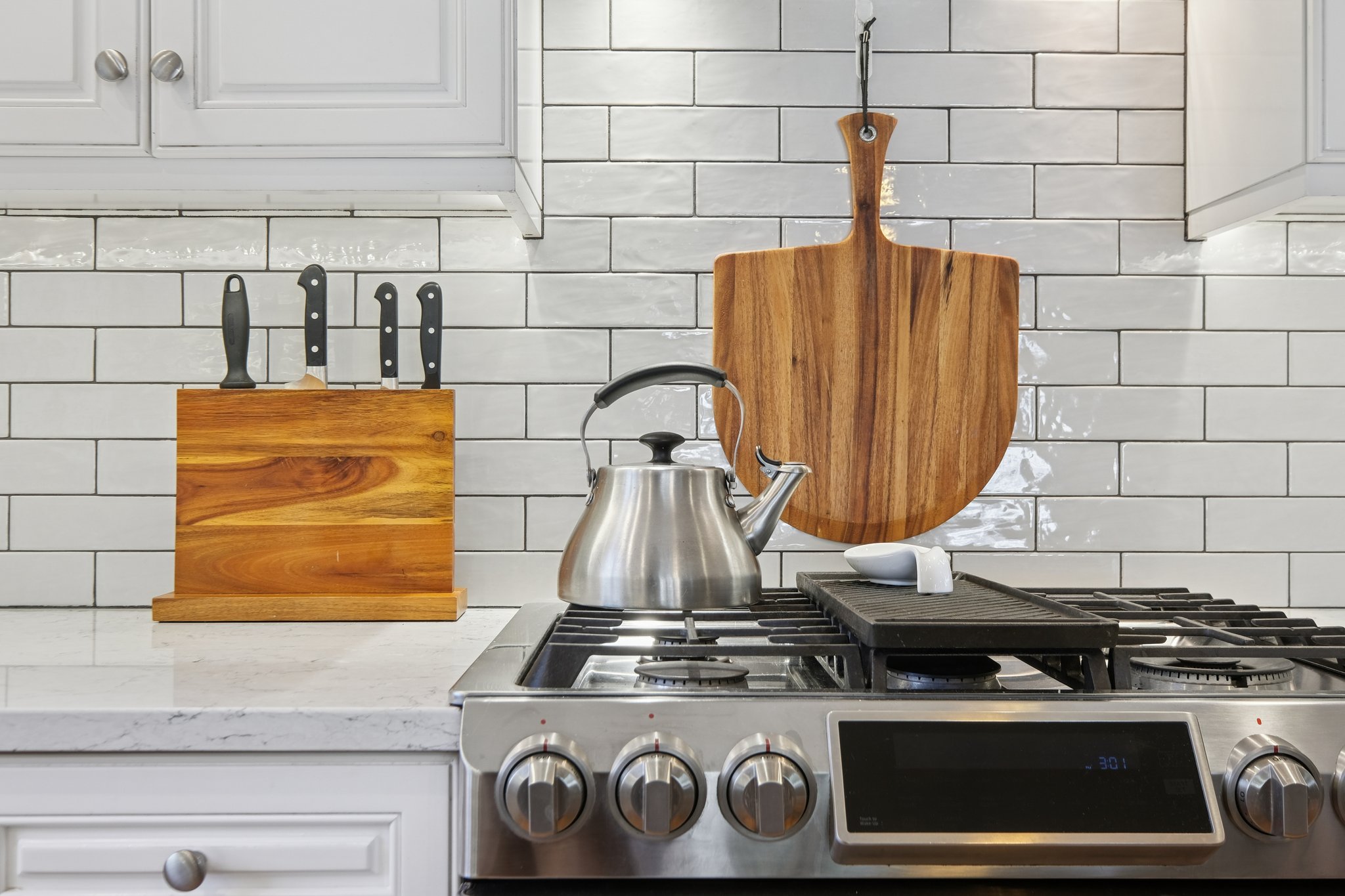 An updated eat-in kitchen with expansive island, beverage bar, and seamless connection to adjacent spaces - the ultimate hub for modern living.