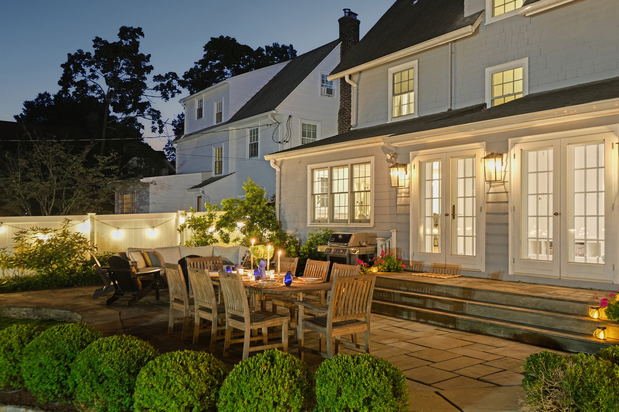 A patio where table talk, celebrations, and candlelight come naturally.