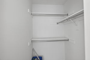 Spacious walk-in closet with ample storage.