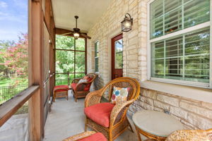 Screened-in porch off the master bedroom overlooking the back yard, pool and Brushy Creek