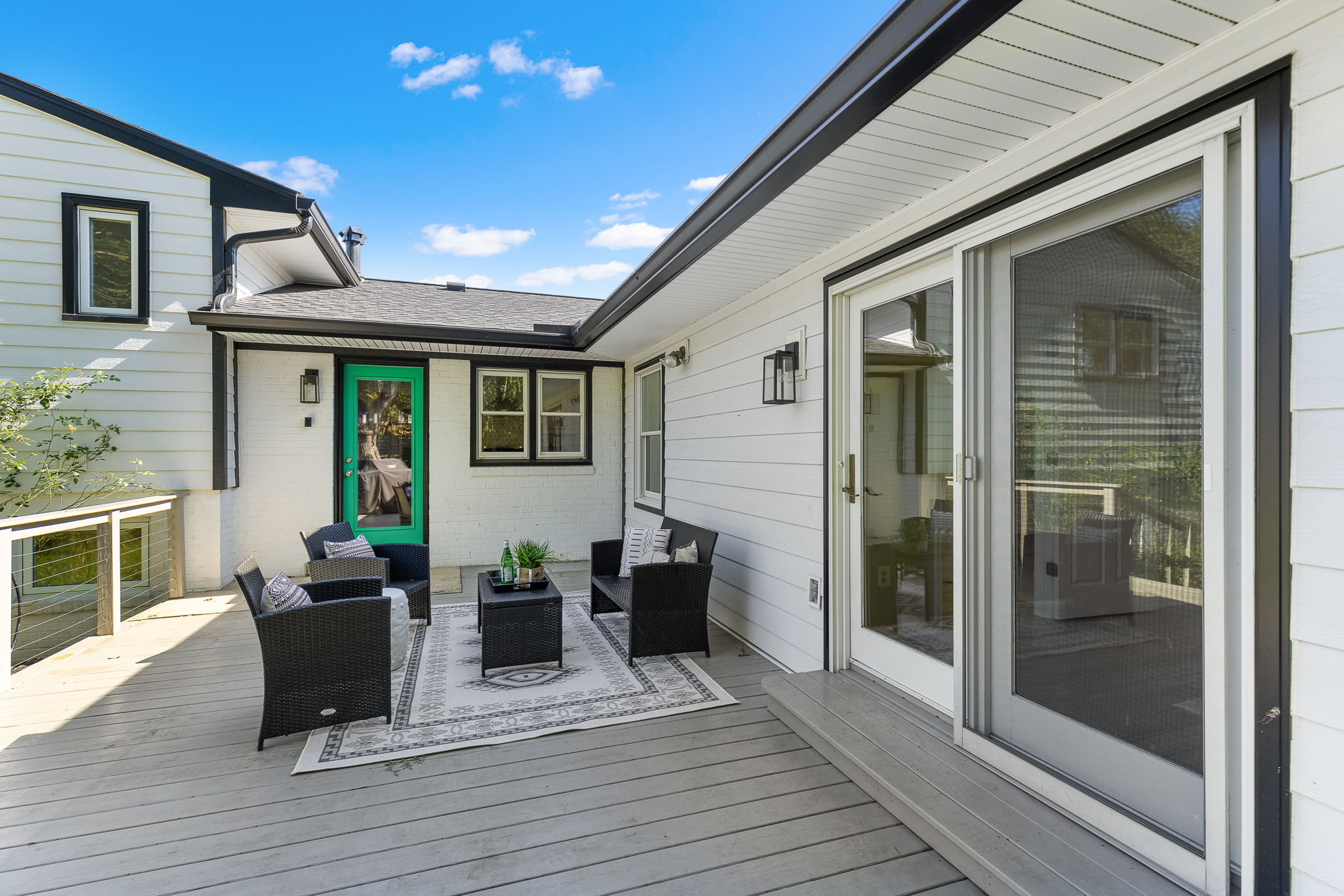 Spacious deck leads to large fenced backyard