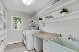 Main level laundry room offers loads of storage