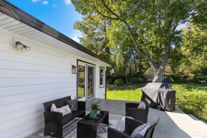 Spacious deck leads to large fenced backyard