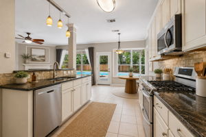 Modern farmhouse kitchen with pool view