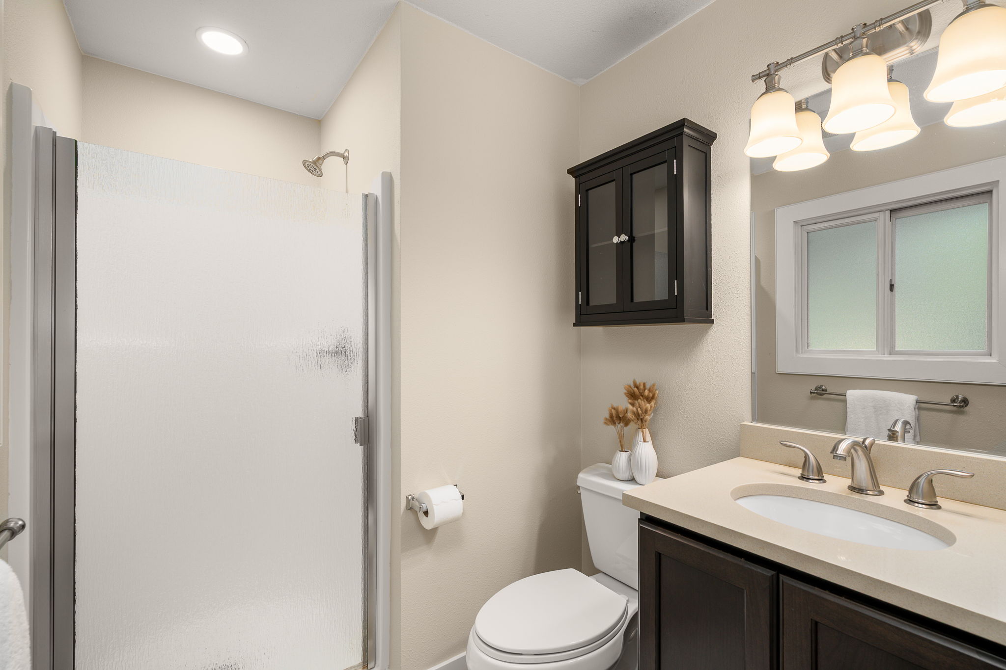 Primary suite with private three-quarter bath.