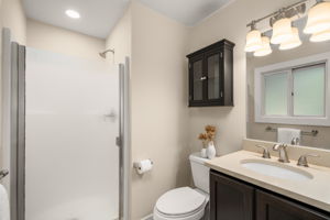 Primary suite with private three-quarter bath.