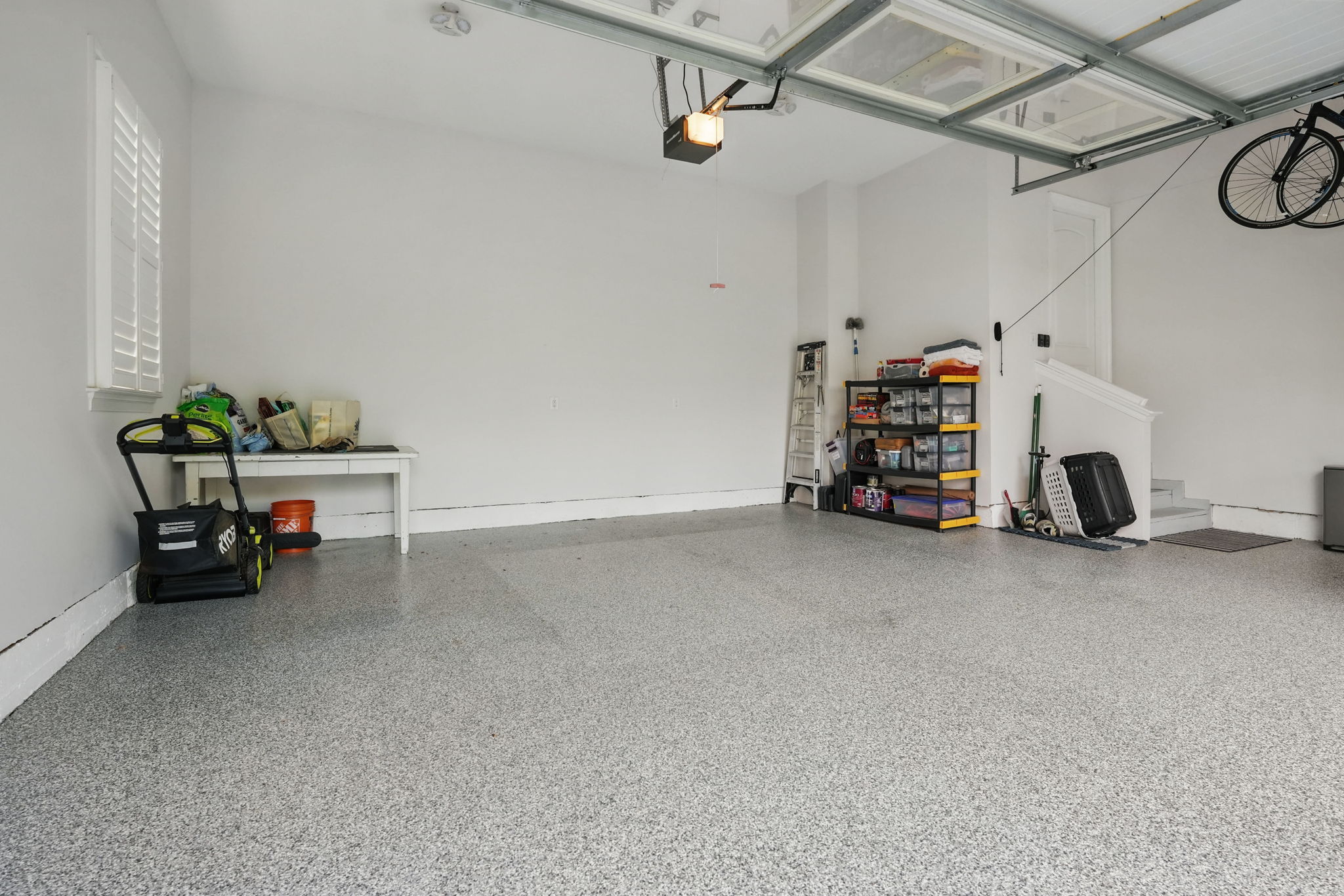 With a TRUE 3-car FINISHED garage.