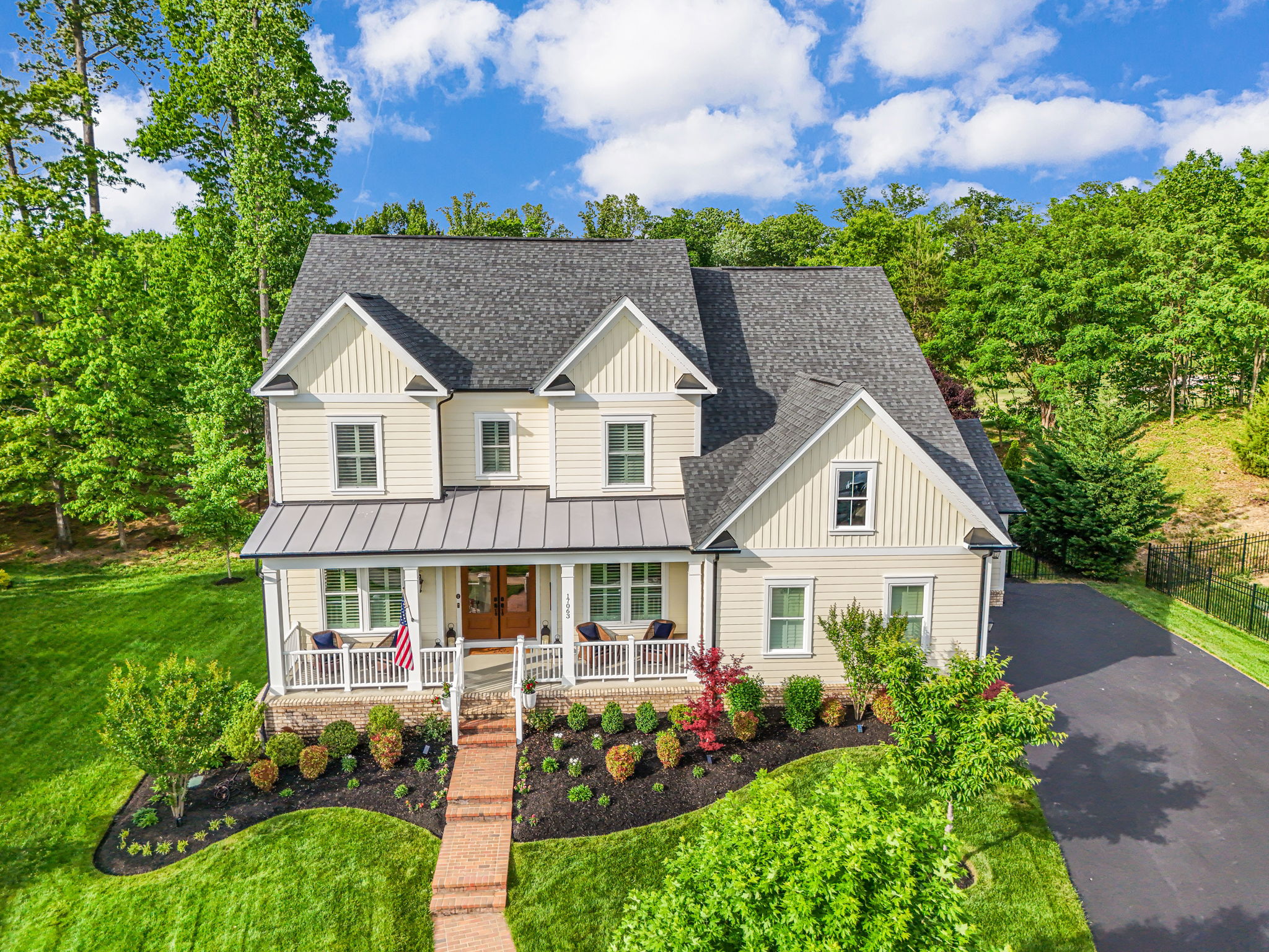 Full covered porch & gorgeous Double French Doors!