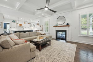 Double-faced gas fireplace with custom detailed surround and mantle