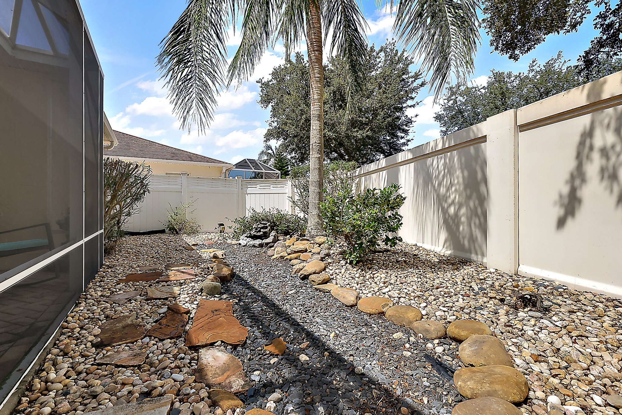 Rear Stoned Yard with Water Feature