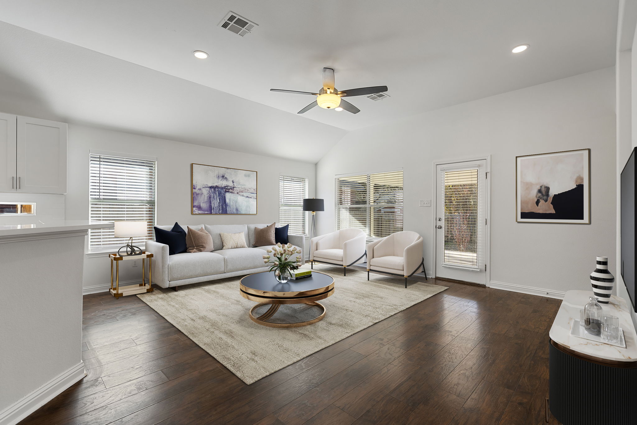 Spacious living room with vinyl wood floors.