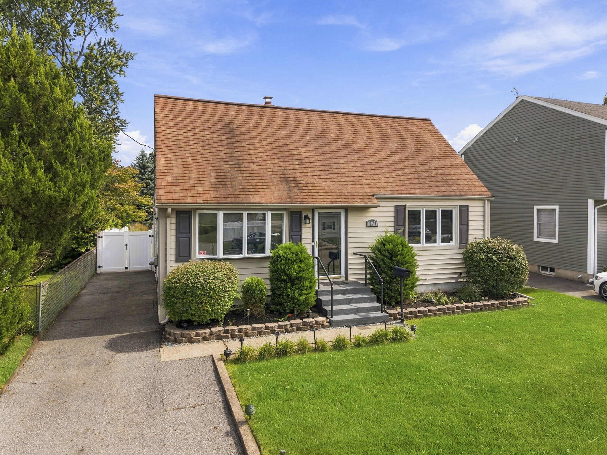 Welcome to 171 Olive Avenue, a 4-bedroom, 2-bath Cape with classic charm and more room to spread out than you might expect.