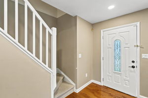 Step inside the  home to a bright living room featuring a wide front window, recessed lighting and hardwood floors that continue through most of the first floor.