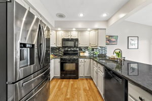 the kitchen addition opens directly to the spacious dining area created by the rear dormer. There’s generous counter space, an island for prep and room to gather around the table. When the weather is nice, open the two sliders and take the gathering outside.