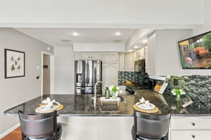 the kitchen addition opens directly to the spacious dining area created by the rear dormer. There’s generous counter space, an island for prep and room to gather around the table. When the weather is nice, open the two sliders and take the gathering outside.