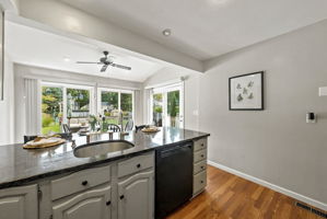 the kitchen addition opens directly to the spacious dining area created by the rear dormer. There’s generous counter space, an island for prep and room to gather around the table. When the weather is nice, open the two sliders and take the gathering outside.