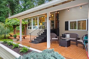 Charming front covered deck to enjoy those hot summer days in the shade or listen to rain drops on the rooftop!