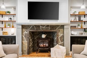 Custom built fireplace mantel and surround. *TV does not convey with home