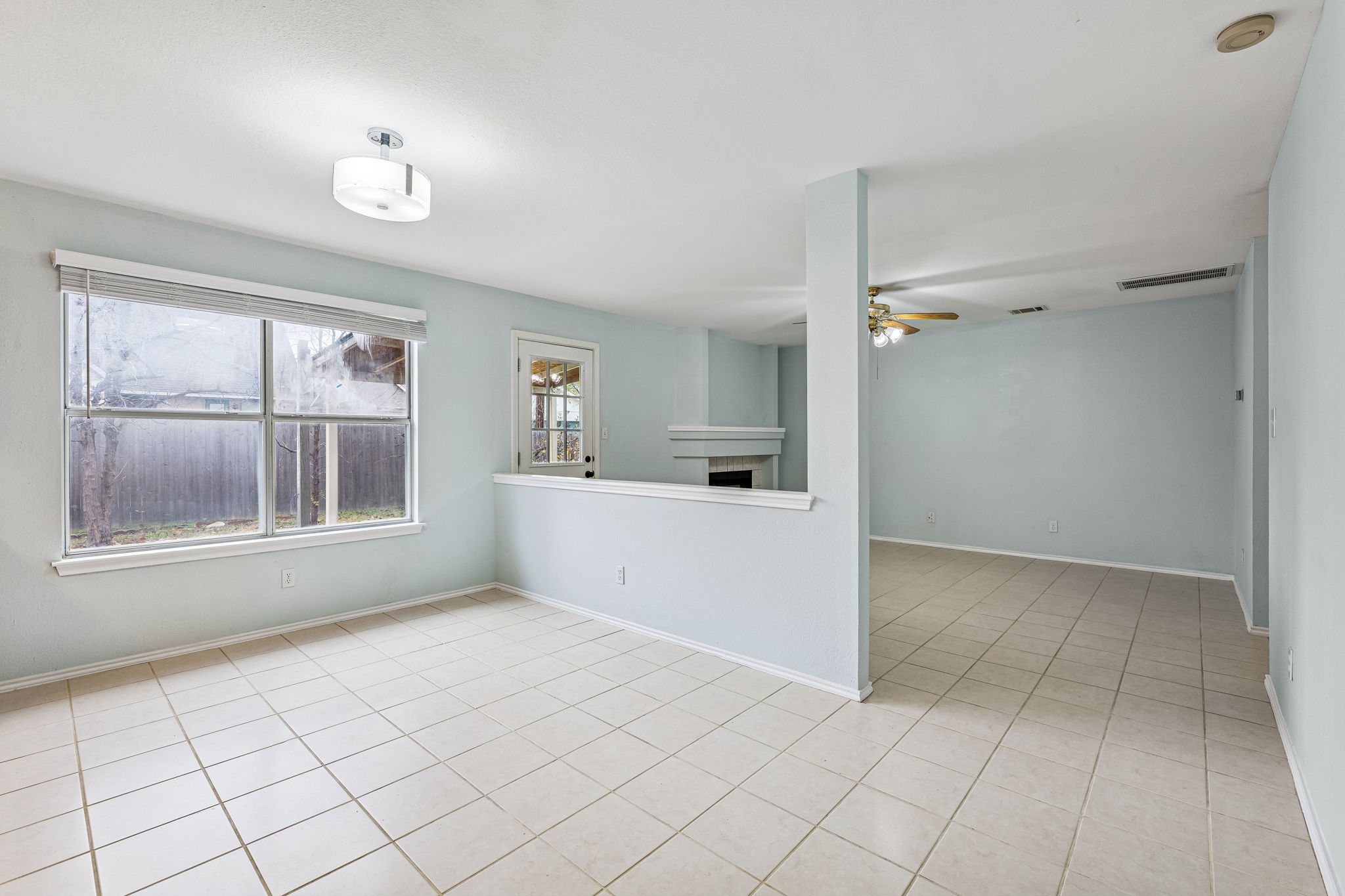The main living area at the back of the house has a cozy gas fireplace that can also be enjoyed from the kitchen and dining room.