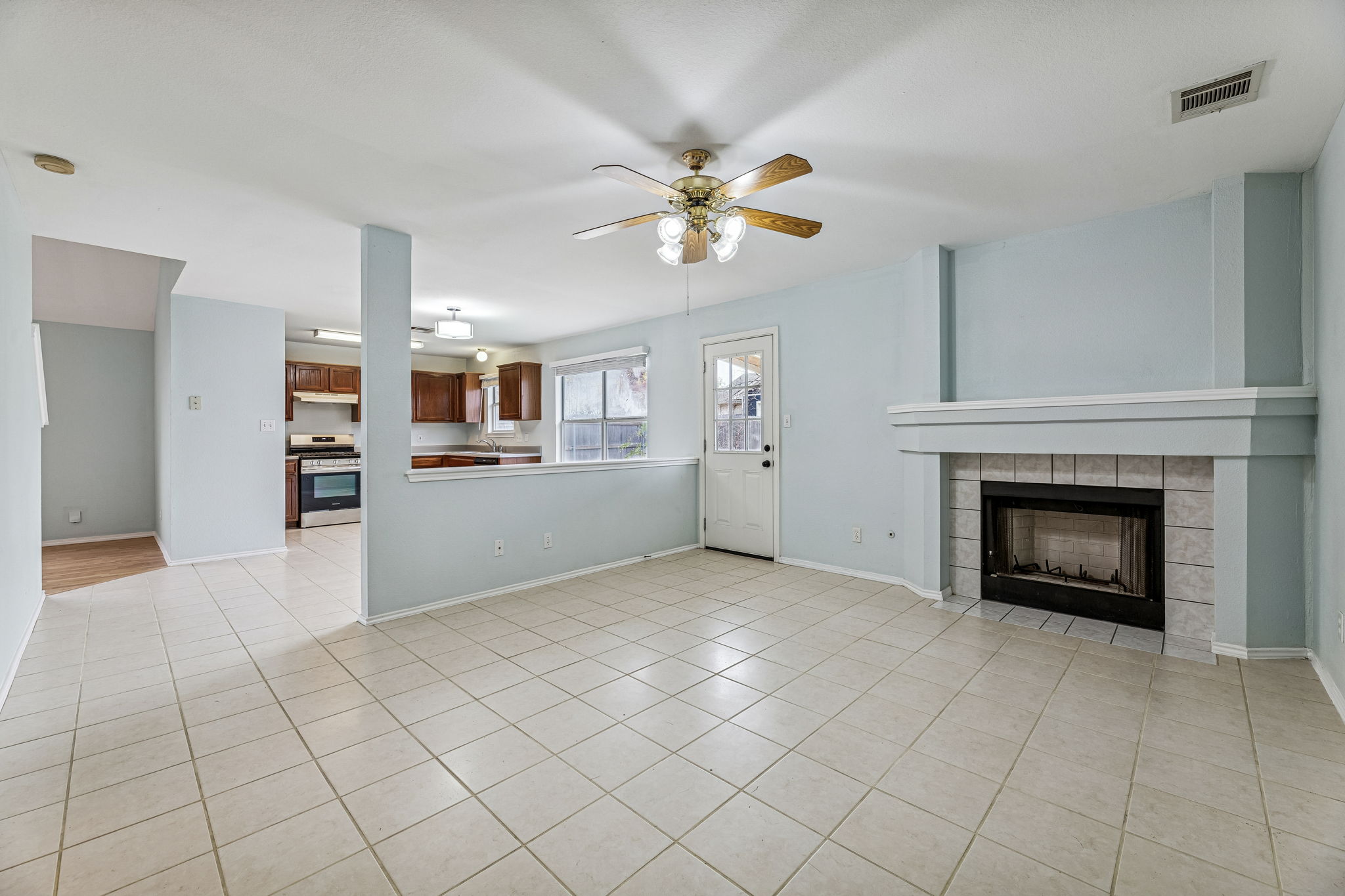 The main living area at the back of the house has a cozy gas fireplace that can also be enjoyed from the kitchen and dining room.
