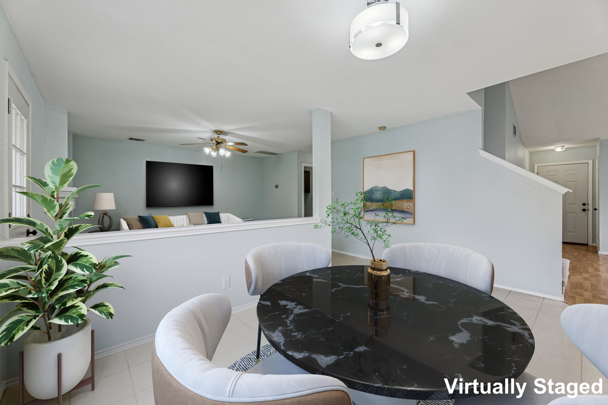 Nice and open floor plan ... the main living area is near the back door, and there's a roomy dining area next to the half wall.